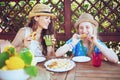Happy young family sitting at table having lunch Royalty Free Stock Photo