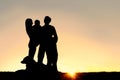 Happy Young Family and Dog Silhouette at Sunset