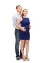 Happy young family expecting child looking up Royalty Free Stock Photo