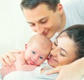 Happy young family. Father, mother and their newborn baby Royalty Free Stock Photo