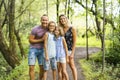 Happy young family in forest having fun together Royalty Free Stock Photo