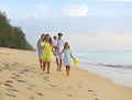 Happy young family have fun on beach run and jump Royalty Free Stock Photo