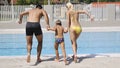 Happy young family have fun on swimming pool Royalty Free Stock Photo