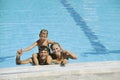 Happy young family have fun on swimming pool Royalty Free Stock Photo