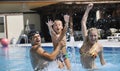 Happy young family have fun on swimming pool Royalty Free Stock Photo