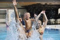 Happy young family have fun on swimming pool Royalty Free Stock Photo