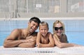 Happy young family have fun on swimming pool Royalty Free Stock Photo