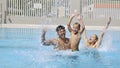 Happy young family have fun on swimming pool Royalty Free Stock Photo