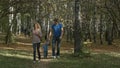 Happy young family is having fun outdoors. Mother, father and their little boy are running in the park. Royalty Free Stock Photo