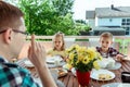 Happy young family having fun during breakfast on terrasse at home Royalty Free Stock Photo