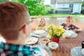 Happy young family having fun during breakfast on terrasse at ho Royalty Free Stock Photo