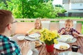 Happy young family having fun during breakfast on terrasse at ho Royalty Free Stock Photo