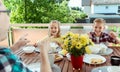 Happy young family having fun during breakfast on terrasse at home Royalty Free Stock Photo