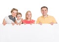 Happy young family holding banner