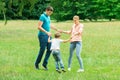 Happy Young Family Holding Hands Royalty Free Stock Photo