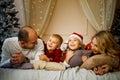 Happy young family with kids having fun celebrating christmas. Christmas time at home. Royalty Free Stock Photo