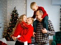 Happy young family with kids having fun celebrating christmas. Christmas time at home. Royalty Free Stock Photo