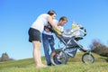 A Happy young family with little baby boy outdoors Royalty Free Stock Photo