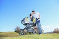 A Happy young family with little baby boy outdoors Royalty Free Stock Photo
