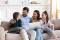 Happy family rest on sofa using modern laptop Royalty Free Stock Photo