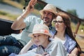 Happy young family- mom,dad and teenage girl daughter traveling together and relaxing in street cafe Royalty Free Stock Photo