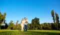 Happy young family in the park on a sunny day. Royalty Free Stock Photo
