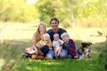 Happy Young Family and Pet Dog Outside Royalty Free Stock Photo