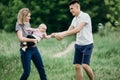 Happy young family playing outside