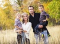 Happy Young Family Portrait with Fall colors