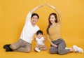 Happy young family sitting on floor with home concept Royalty Free Stock Photo