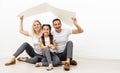 happy young family sitting on floor with home concept Royalty Free Stock Photo