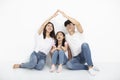 Young family sitting on floor with home concept Royalty Free Stock Photo