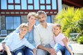 Happy young family sitting in the garden Royalty Free Stock Photo