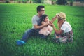 Happy young family spending time in the park, Father mother and daughter playing Royalty Free Stock Photo