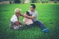 Happy young family spending time in the park, Father mother and daughter playing Royalty Free Stock Photo