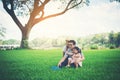 Happy young family spending time in the park, Father mother and daughter playing Royalty Free Stock Photo