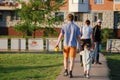 Happy young family spending time together outside in green nature