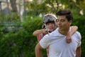 A happy young family spends time playing together in the garden Royalty Free Stock Photo