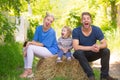 Happy young family of three having fun together launching. Cheerful funny parents playing with son outdoor. Father Royalty Free Stock Photo