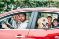 happy young family travelling by car