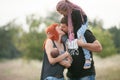 Happy young family with two children on walk in park. Parents ar Royalty Free Stock Photo