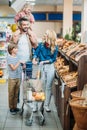 happy young family with two kids shopping together Royalty Free Stock Photo