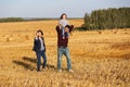 Happy young family with two year old girl walking in a field Royalty Free Stock Photo