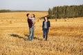 Happy young family with two year old girl walking in a field Royalty Free Stock Photo