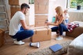 Happy family unpack boxes moving to new home Royalty Free Stock Photo
