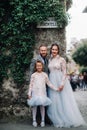 A happy young family walks through the old town of Sirmione in Italy.Stylish family in Italy on a walk Royalty Free Stock Photo