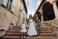 A happy young family walks through the old town of Sirmione in Italy.Stylish family in Italy on a walk Royalty Free Stock Photo