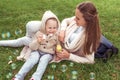 Happy young family, woman mom, little boy inflates soap bubbles, rest in park, concept parenting child care and love Royalty Free Stock Photo