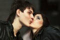 Happy young fashion couple kissing outdoor Royalty Free Stock Photo
