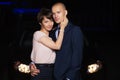 Happy young fashion couple in love next to car at night Royalty Free Stock Photo